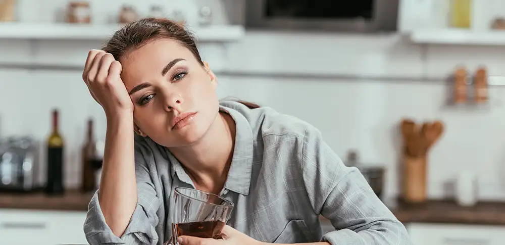 woman showing signs of alcohol addiction